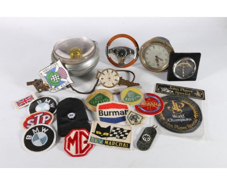 Vintage Marchal Grande Portee 642 car head lamp, a Smith's of London dash clock, a clock in the form of a steering wheel, clo