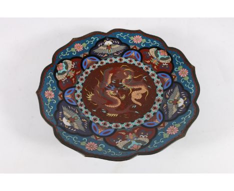 Chinese cloisonné charger dish having central dragon panel with aventurine inclusions and shaped edge, 31cm diameter.  Few mi