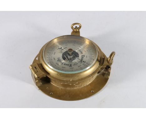 Plastimo wall barometer in brass case in the form of porthole, 23cm diameter. 