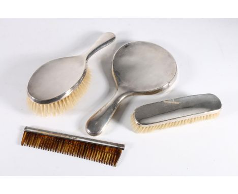 Sterling silver backed four piece vanity set comprising mirror, brushes and a comb, J and R, Chester. 