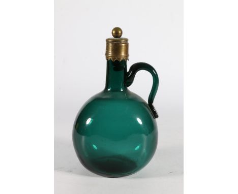 Victorian green glass ewer flask with brass mounts, 21cm tall.  Stopper loose.  Light scratching to decanter, otherwise well.