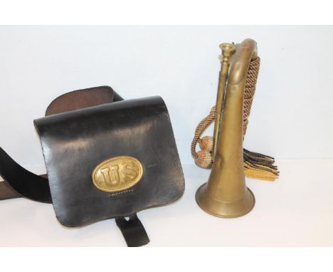 United States Army black leather cartridge belt and pouch with brass 'US' badge and a brass bugle, (2). 