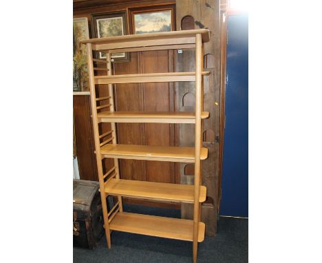 Ercol beech six shelf open front bookcase, 185 x 96 x 35cm. One shelf has two small sections of damage, approx. 2 and 1.5cm.