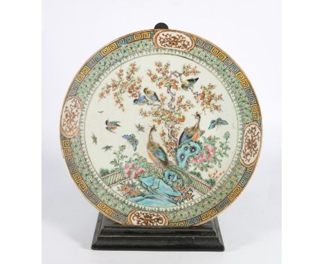 Antique Qing Dynasty Chinese porcelain charger dish decorated with peacocks and birds, 35cm diameter, with ebonised stand.  S