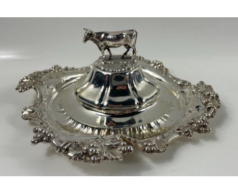 A silver hallmarked Sheffield 1835, butter tray and lid with bovine finial by silversmith HENRY WILKINSON &amp; CO, liner mis