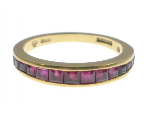 A 750 stamped yellow gold half eternity style 16 graduating ruby set RING size O, gross weight 3.30g approx