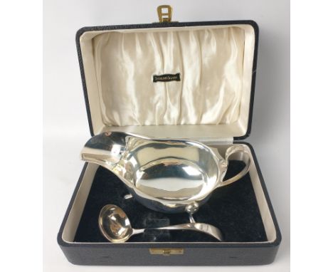 Boxed set of Sheffield sterling silver 1952 SAUCEBOAT (15.5cm x 9.5cm x 8.5cm) and LADLE (length 13cm x 4cm) in original pres