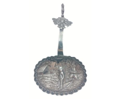 A nice quality Import CHESTER Hallmarked 1901 possibly Dutch tea caddy spoon with repousse design depicting a rural scene wit