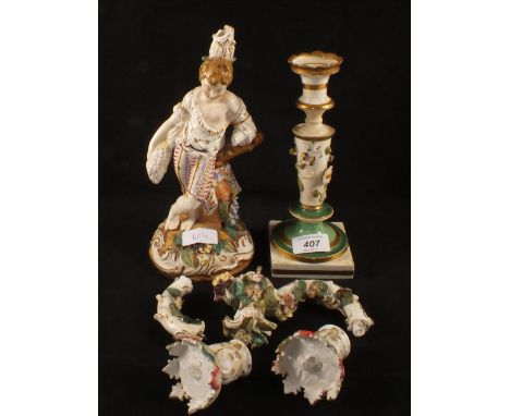 A 19th Century continental porcelain boy figurine candelabra and floral encrusted candlestick (as found)