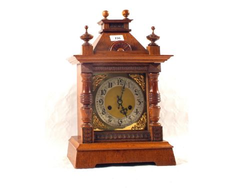 An Oak cased striking mantel clock