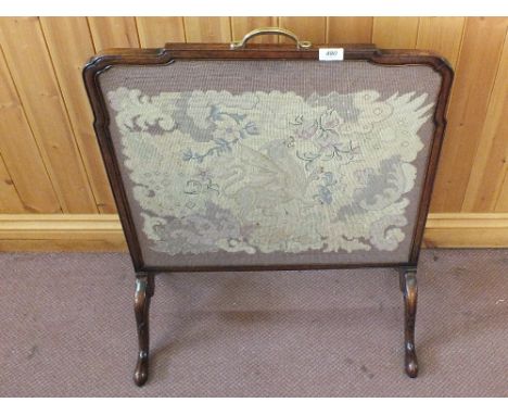 A Mahogany needle work fire screen