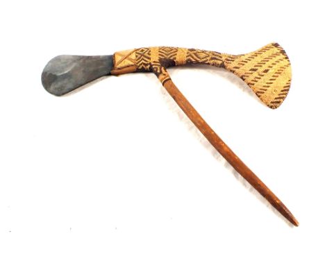 A Papua New Guinea tribal ceremonial axe with stone blade and woven fibre cladding