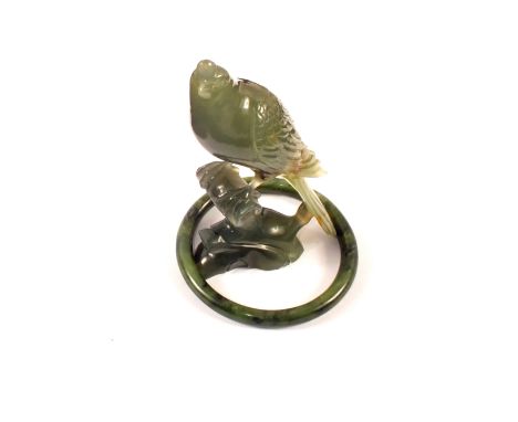A hardstone Chinese carving of a bird and a Chinese Jade bangle