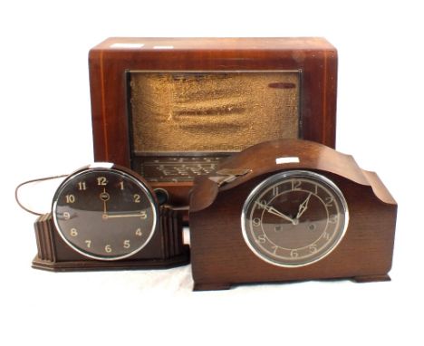 A Pye mains radio, two mantel clocks and an oval gilt mirror