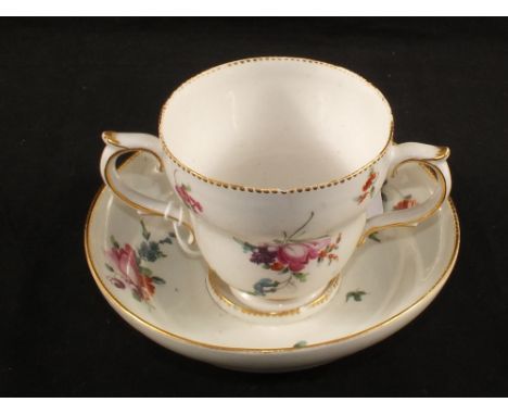 An 18th Century floral painted chocolate cup and trembleuse saucer, Chelsea-Derby gold anchor type mark (light rim chips)