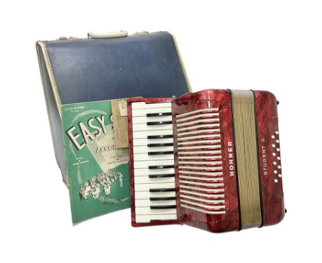 German Hohner student II compact accordion with 26 keys and 12 bass registers in a hard case With tutor
