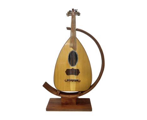 20th century Middle Eastern six string lute with a segmented back and a purpose designed hardwood stand