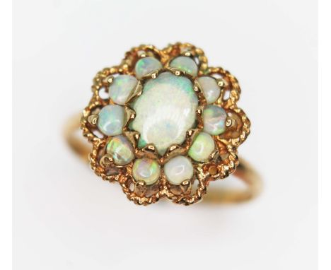 An opal cluster ring, the head measuring approx. 14.57mm x 14mm, 9ct import marks, gross wt. 2.4g, size N.&nbsp;Condition -&n