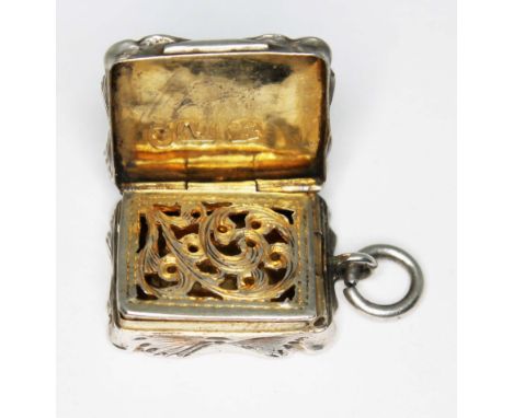A Victorian miniature silver vinaigrette, Alfred Taylor, Birmingham 1855, length 25mm.  Condition - general wear including di