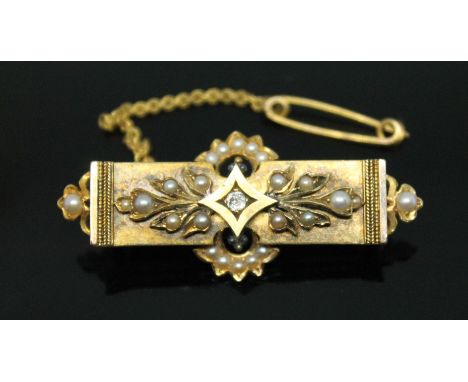 A Victorian Estruscan revival diamond and split pearl brooch, length 47mm, gross wt. 7.2g.  