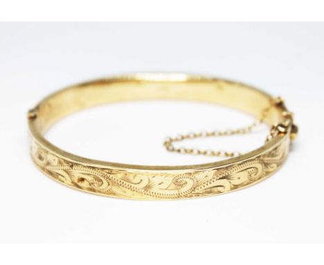 A hallmarked 9ct gold bangle, diameter approx. 5.5cm, wt. 13.1g.  Condition - various dings, mainly to interior, general wear