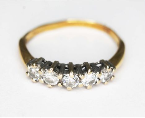 A five stone diamond ring, 18ct gold import marks, gross wt. 2g, size K (band bent).  