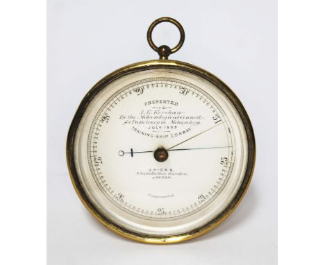 A ship's presentation gilt brass barometer, the dial inscribed 'Presented to J.E. Kershaw by the Meteorological Council for P