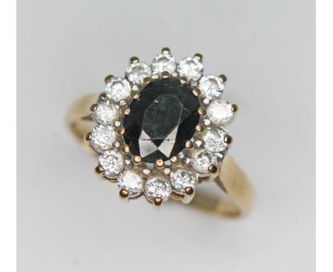 A hallmarked 9ct gold sapphire and CZ cluster ring, gross wt. 3g, size P.  