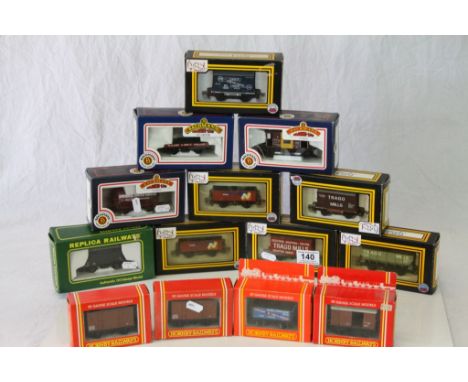 14 Boxed OO gauge items of rolling stock trucks and wagons to include Dapol x 6, Hornby x 4, Bachmann x 3 and Replica Railway
