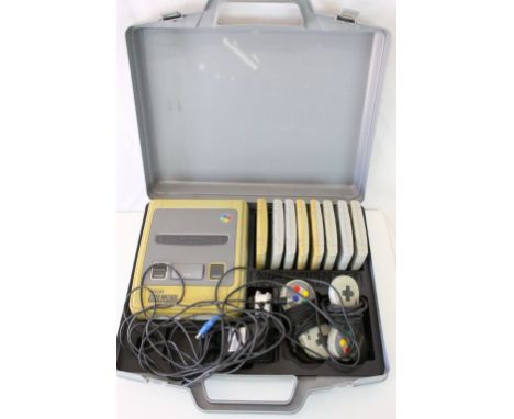 Retro Gaming - Super Nintendo Entertainment System SNES console with 2 x controllers, 8 x games featuring Striker, Superstar 