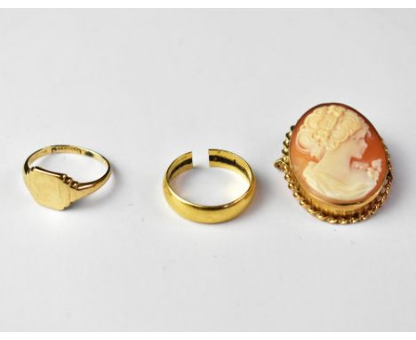 An 18ct gold band ring with a cut shank, size approx G, approx 3.2g, a small 9ct gold signet ring, size H, approx 2g and a 9c