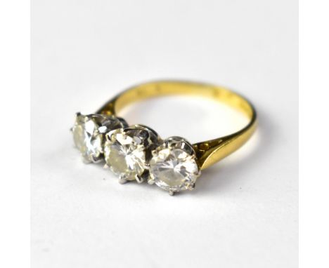 An 18ct gold three-stone diamond ring, the three claw set diamonds approx 0.5ct each (diameter of central stone 5.5mm, flanke