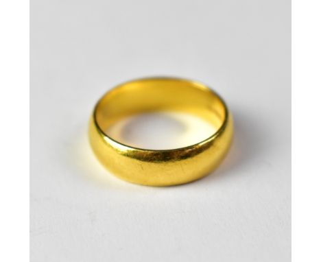 A 22ct gold band ring, inscribed to interior 'Gary and Pam 15.4.00', size U, approx 8g.
