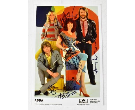 ABBA; a colour promotional photograph, bearing the band's signatures.We have not authenticated these signatures, please satis