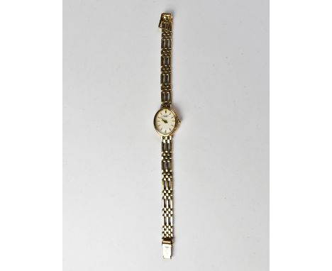 ROTARY; a ladies' modern watch with a 9ct gold head, the oval dial set with raised gold baton numerals, marked 'Rotary', on a