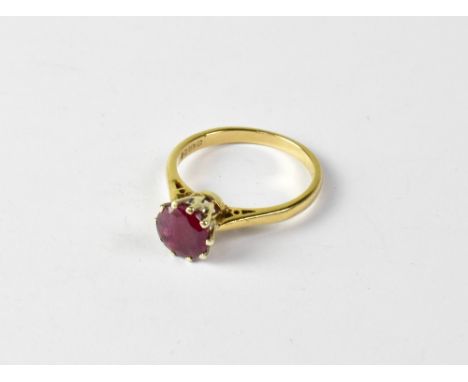 A 9ct gold ruby ring with claw set round cut ruby, size R, approx 3.2g.