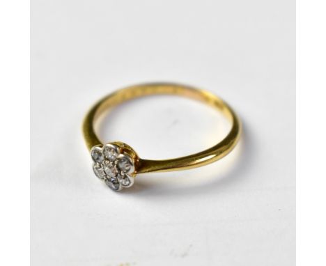 An 18ct gold tiny diamond floral cluster ring, size O, approx 2g.