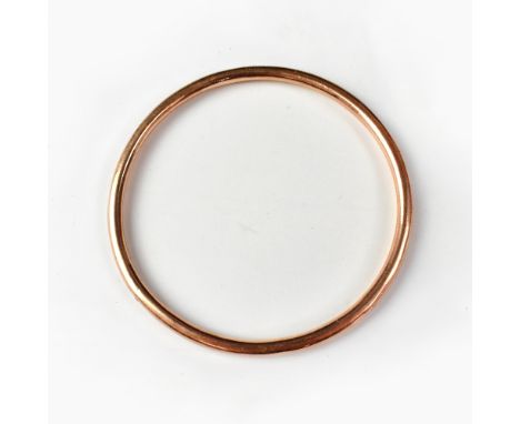 A 9ct gold hollow bangle stamped '9CT', approx 6g.