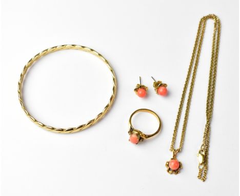 A 9ct gold ropetwist bangle, stamped '9CT', approx 17.5g, together with a set of gold plated jewellery mounted with pink cora