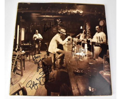 LED ZEPPELIN; LP 'In Through The Out Door', with outer brown paper sleeve, bearing signatures.We have not authenticated these