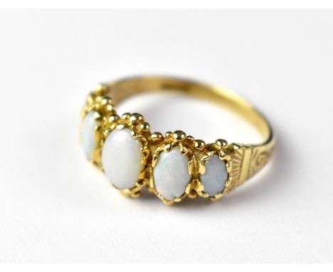 A 9ct gold opal ring, the five white oval opals with blues and greens, with patterned shoulders, size O, approx 3.5g. CONDITI