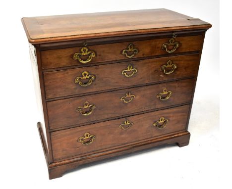 A late 18th/early 19th century mahogany chest of four drawers with brass swing handles, raised on bracket supports, approx 78