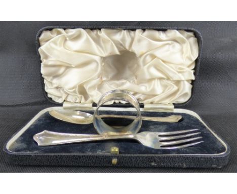 An Elizabeth II hallmarked silver three-piece Christening set comprising spoon, fork and napkin ring, all hallmarked for Atki