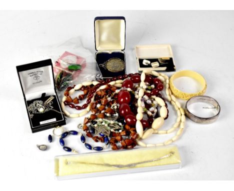 A quantity of costume jewellery to include a dress cluster ring set with central amethyst, a hallmarked silver bangle, a cher