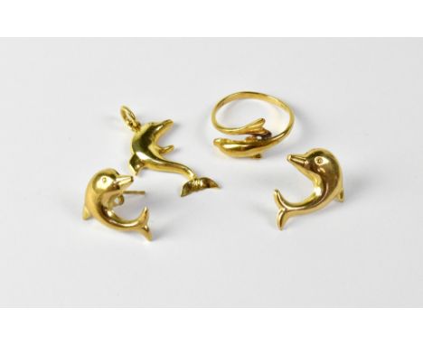 A 14ct gold ring in the form of a dolphin, stamped '585', size J, together with a matching yellow metal dolphin pendant and p