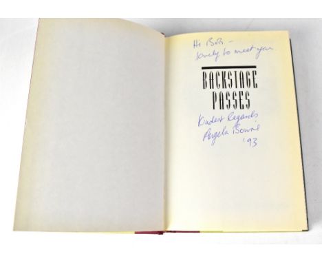 DAVID BOWIE; 'Backstage Passes' by Angela Bowie and Patrick Carr, bearing the signatures of Angela Bowie and David Bowie.We h
