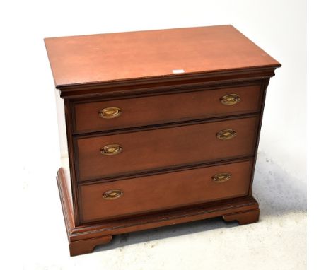 STAG; a mahogany three-drawer chest raised on bracket feet, 74.5 x 82.5 x 46.5cm, and two matching side tables with brush-in 