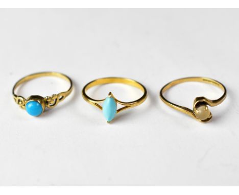 Two turquoise stone dress rings, one hallmarked for 9ct gold, with half bead in bezel mount, the other of marquise shape, on 