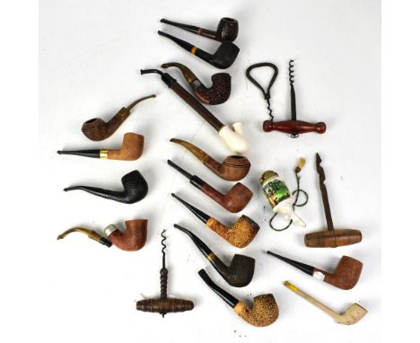 A collection of 19th and early 20th century pipes to include clay and briarwood examples, a ceramic pipe bowl printed with im