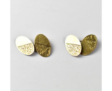 A pair of 9ct gold cufflinks, the oval cufflinks with half diagonal floral design, the other half blank, united with a gold c